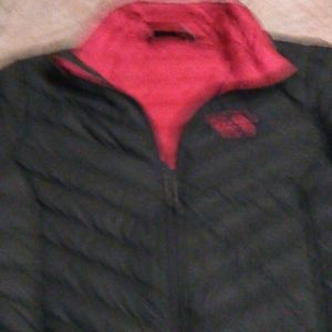 A women's Mountain Hardwear puff jacket